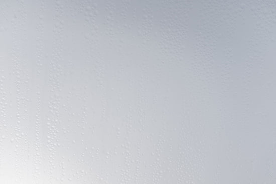a white wall with water drops on it