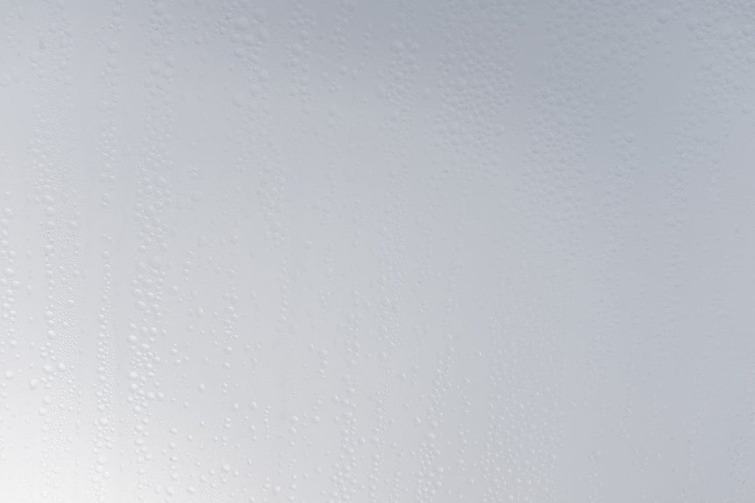 a white wall with water drops on it