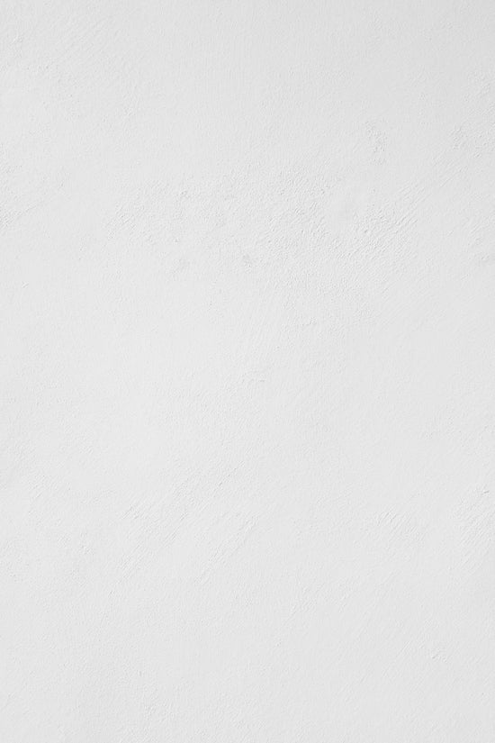 a man riding a snowboard down a snow covered slope