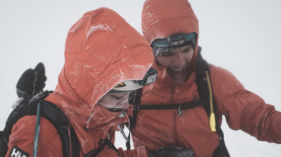 a man and a woman walking in the snow