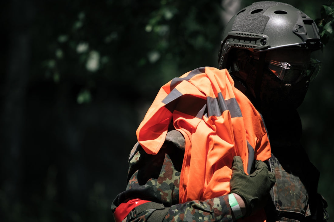 man in orange and black helmet and black helmet