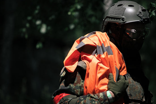 man in orange and black helmet and black helmet