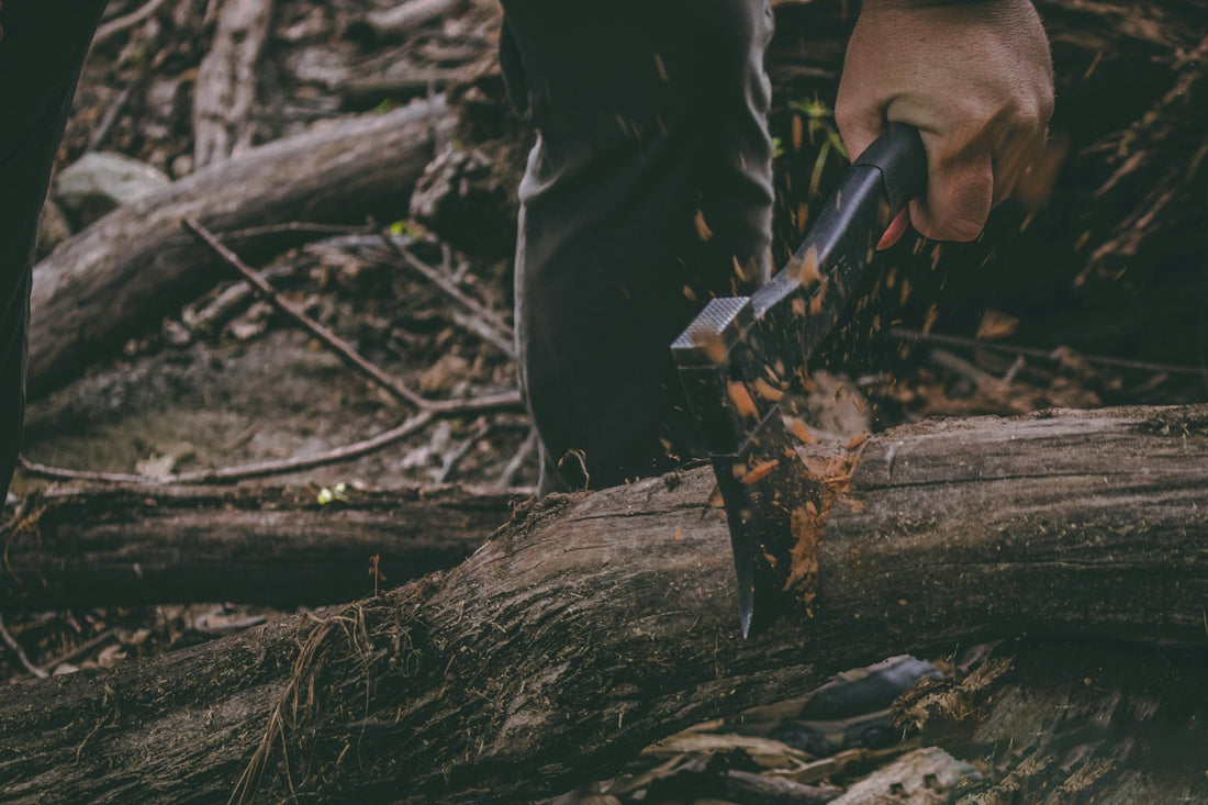 person holding black and gray knife