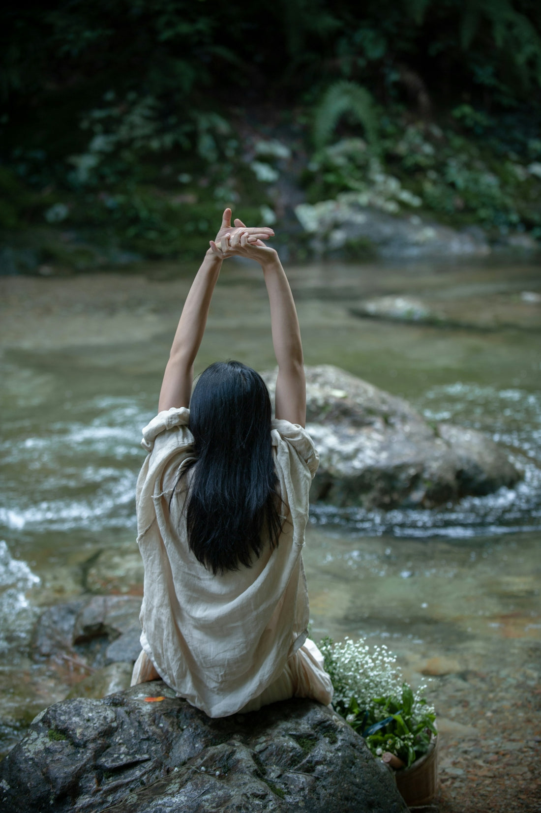 woman in white shirt standing on river during daytime