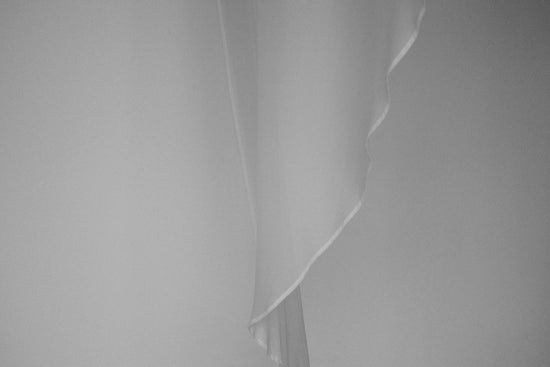 a black and white photo of a curtain