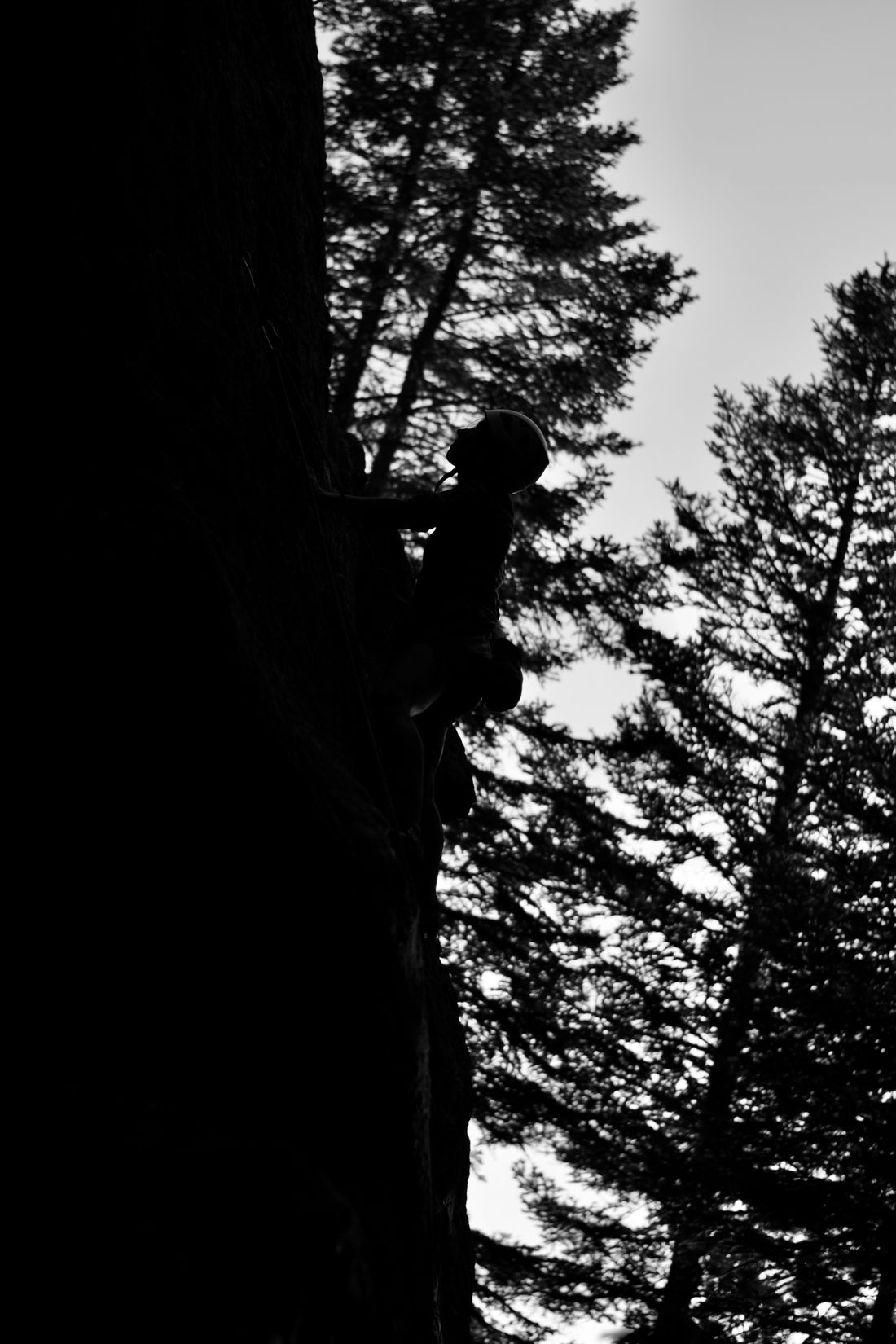 a person climbing a rock