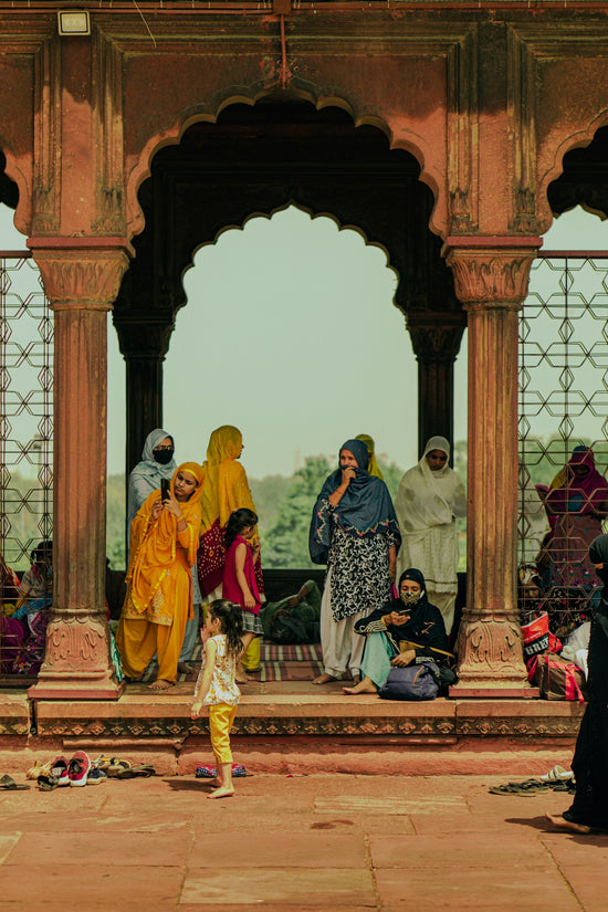 a group of people standing on a balcony
