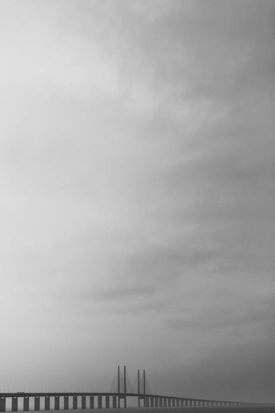 a bridge with a cloudy sky