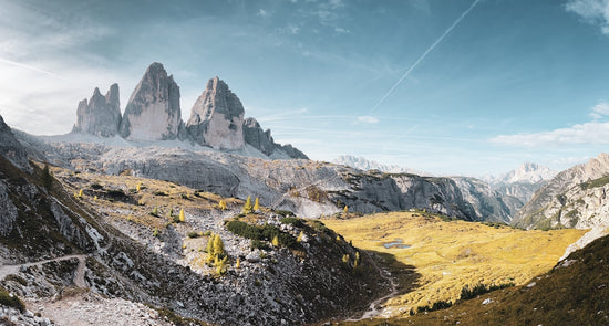 a view of a mountain range from a trail