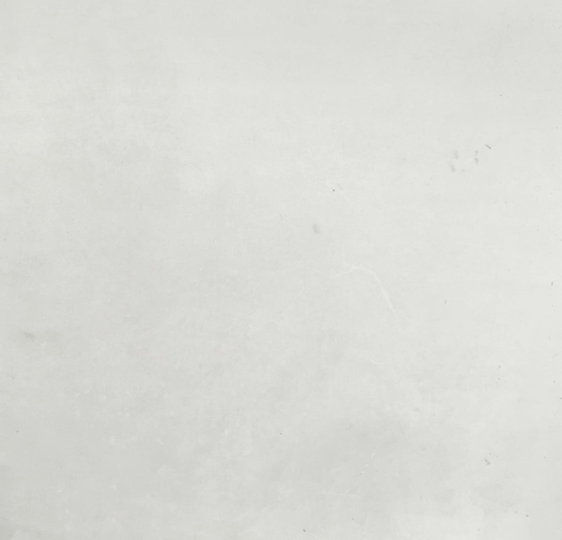 a black and white photo of a person on a surfboard