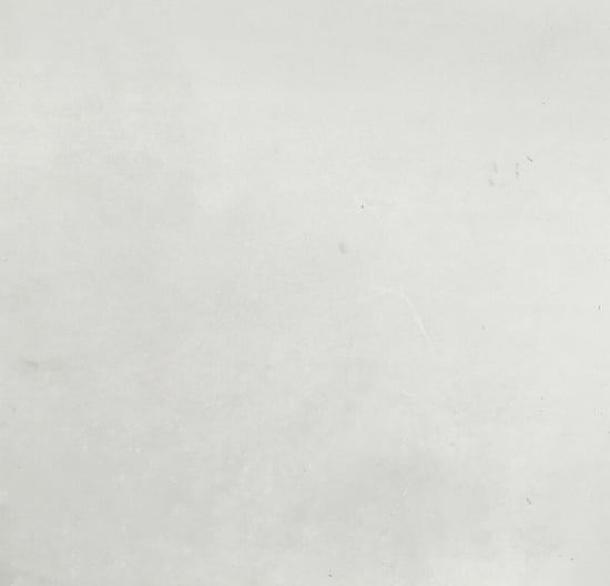 a black and white photo of a person on a surfboard