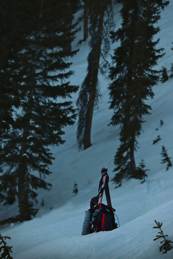 a backpack sitting on top of a snow covered slope
