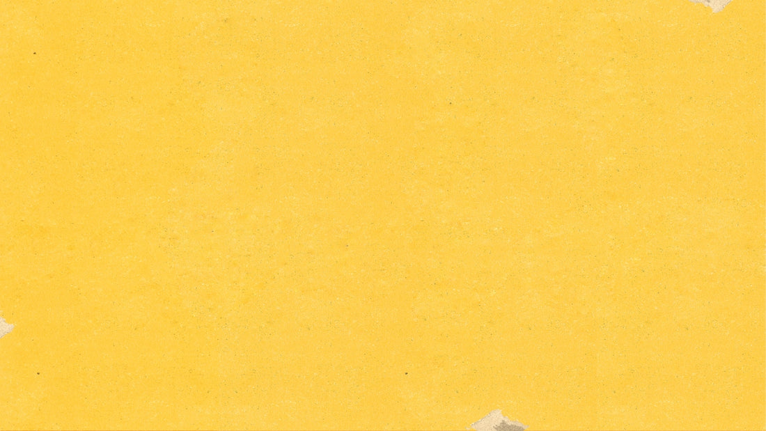 a piece of yellow paper with torn edges