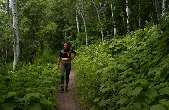 A person walking down a trail in the woods