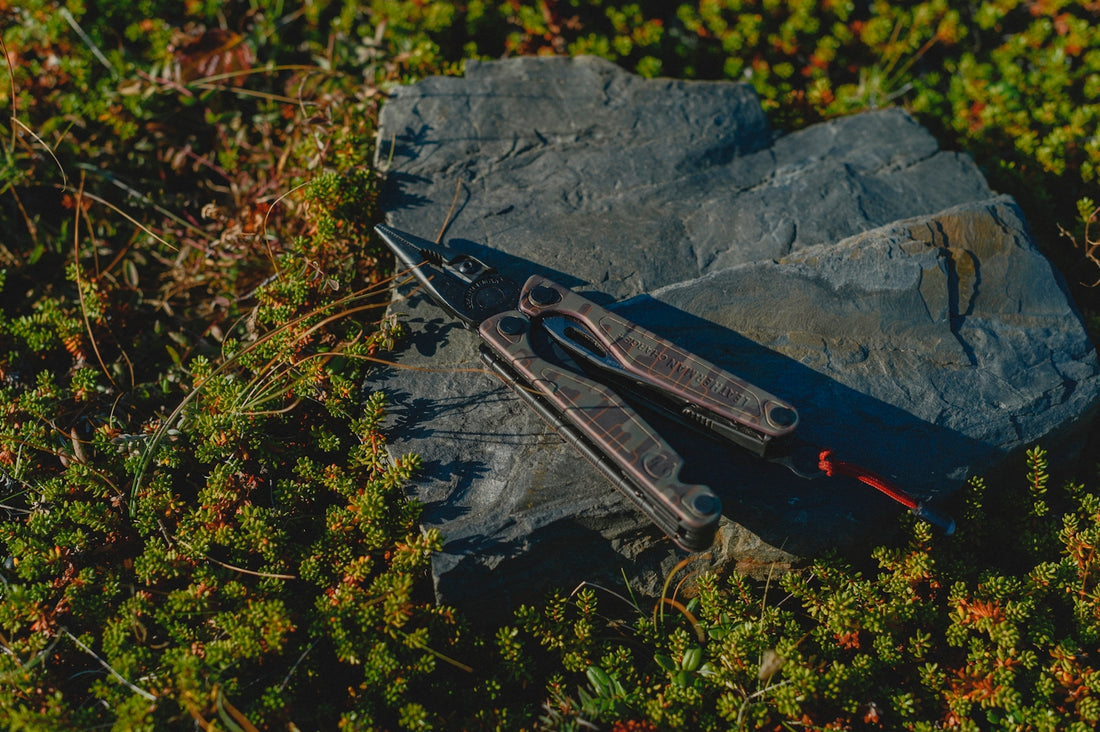 A pair of scissors sitting on top of a rock