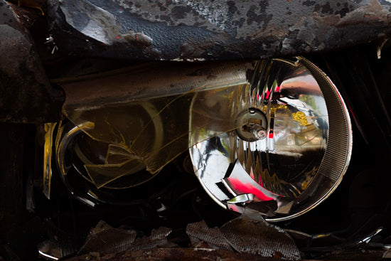 A close up of a broken down car