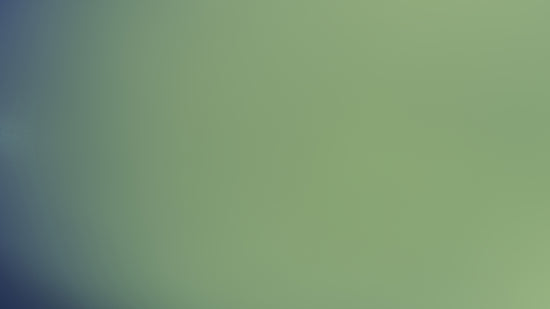 The image shows a blurry, greenish-blue gradient.