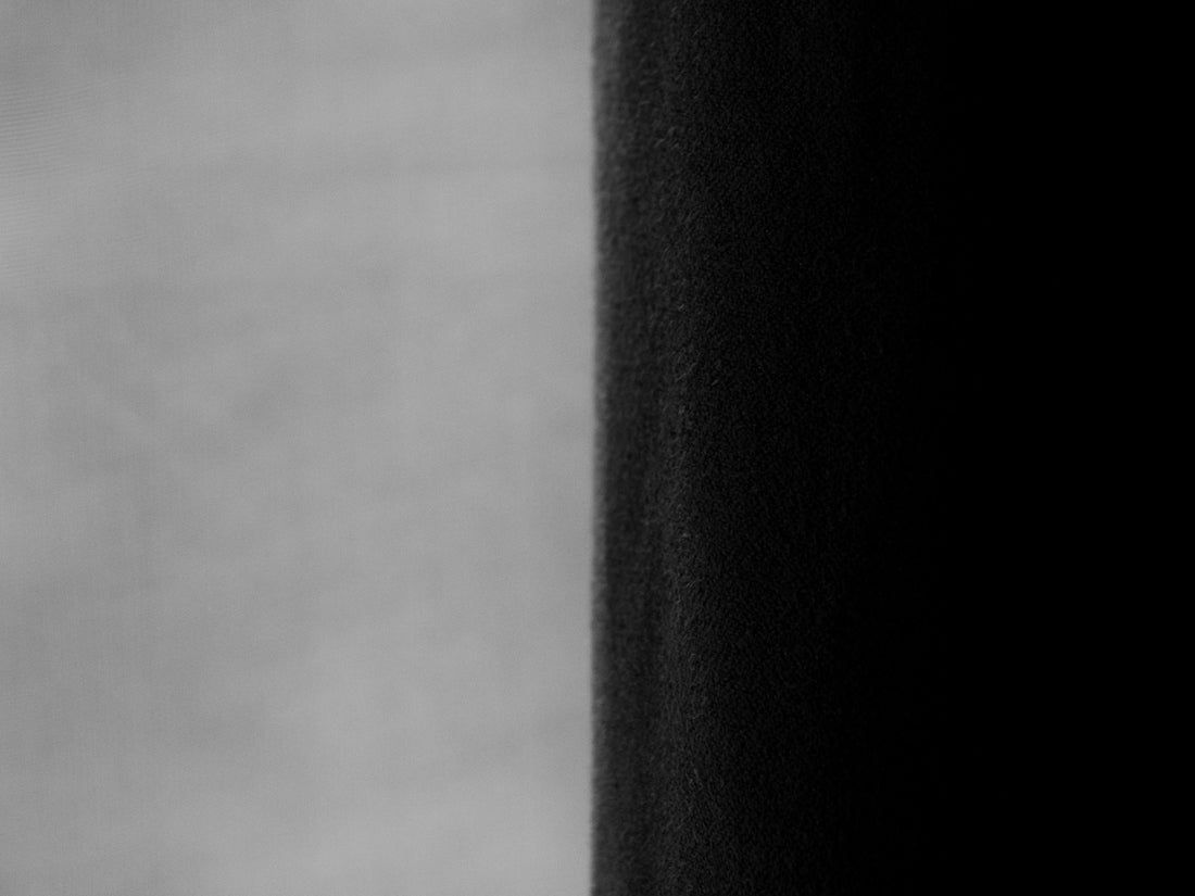 A split screen displays black and white contrast.