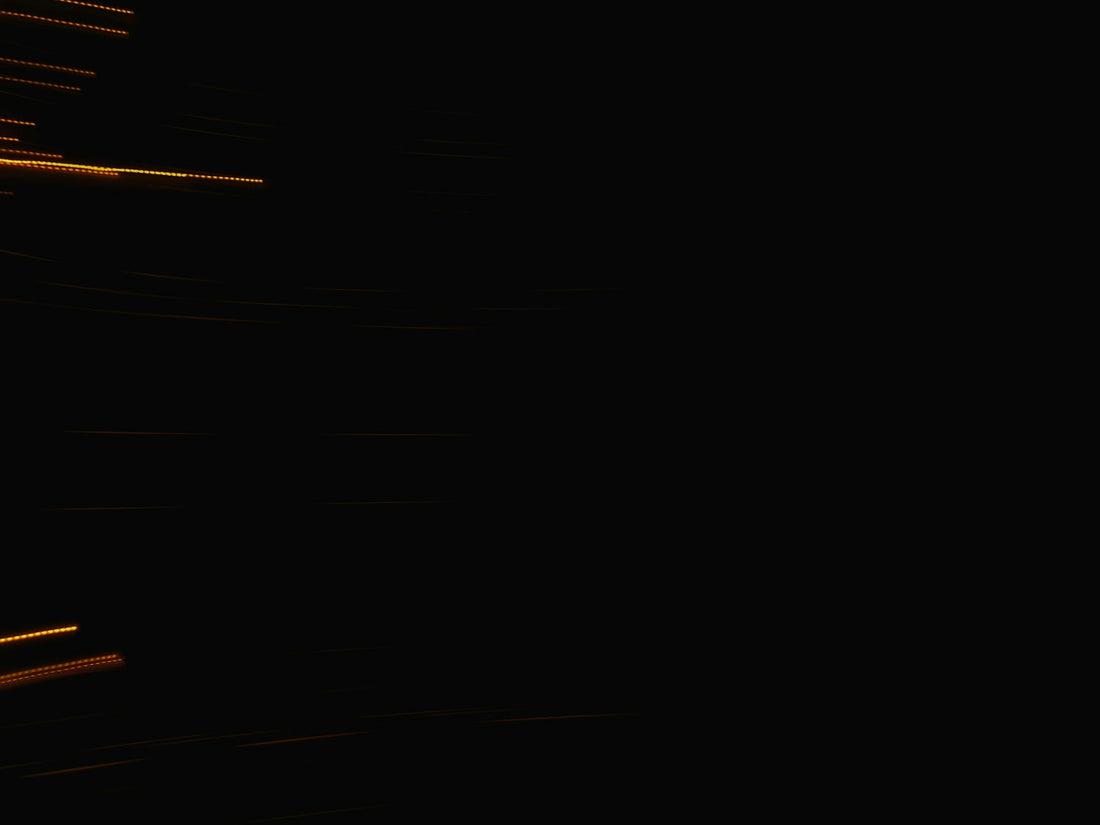 Streaks of light against a dark background