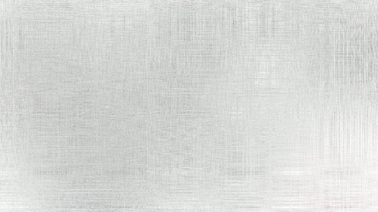 A brushed metal surface with subtle texture.