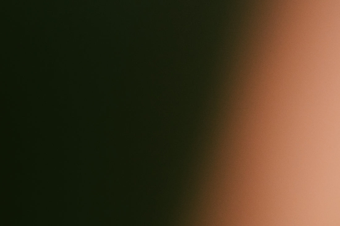 Dark green fading to light orange gradient