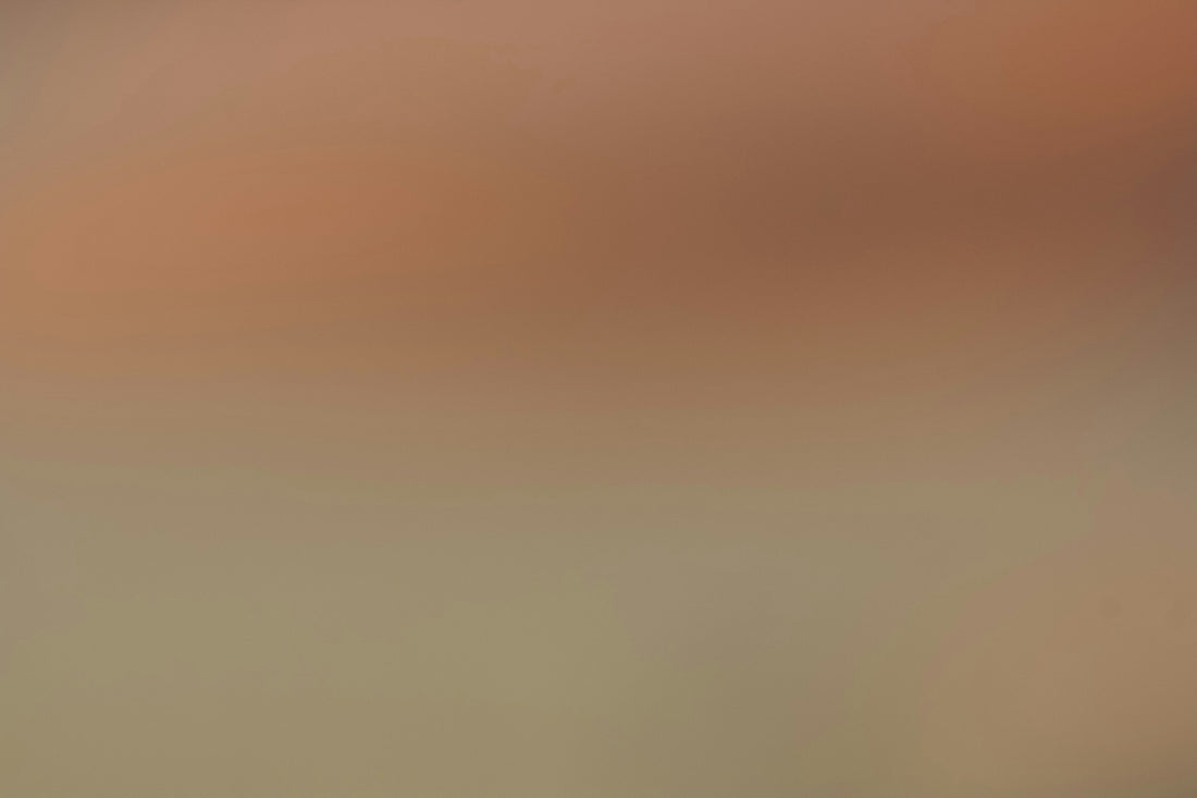 Soft gradient of warm peach and neutral beige colors.