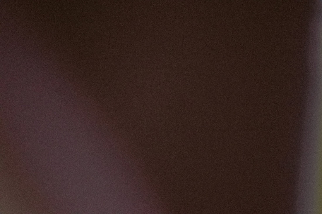A dark brown background with a subtle gradient.