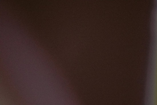 A dark brown background with a subtle gradient.