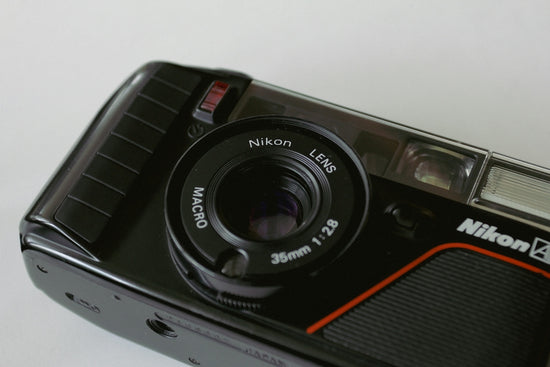Close-up of a nikon camera lens with macro lens