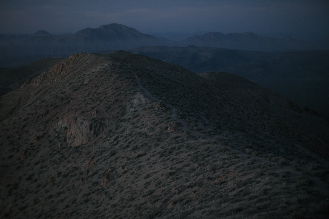 Rugged mountains under a twilight sky.