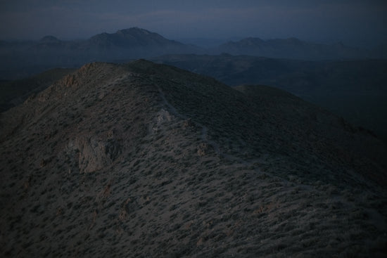 Rugged mountains under a twilight sky.