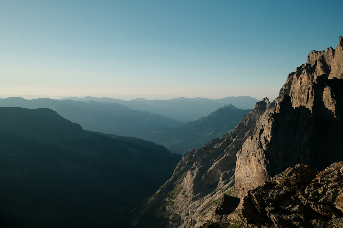 Vast mountain range with rugged peaks and distant valleys.